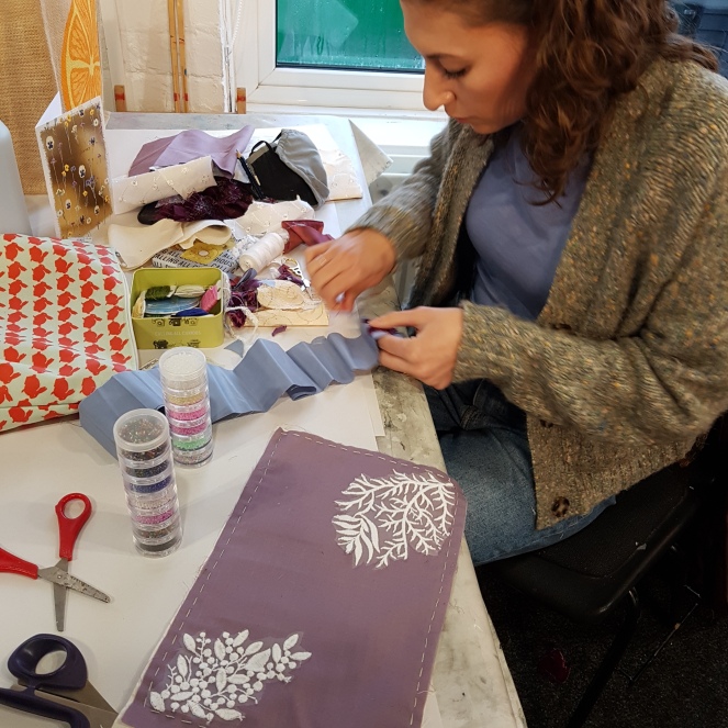 An art textiles student doing applique  at one of my workshops, 2022.